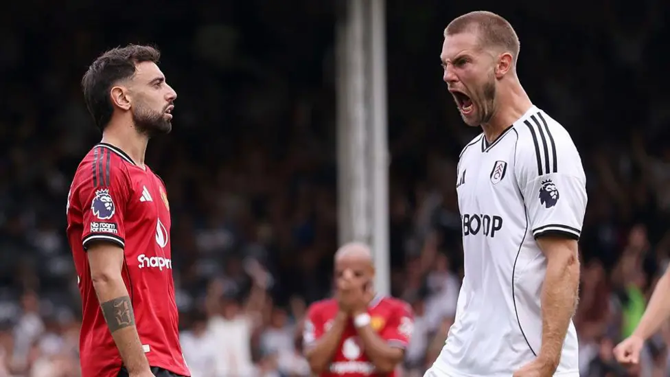 Bruno Fernandes (left) and Joachim Andersen react to the first-half penalty miss by Fernandes