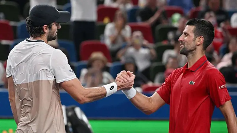 Novak Djokovic (right) will not win a record-extending fifth title in Shanghai this year