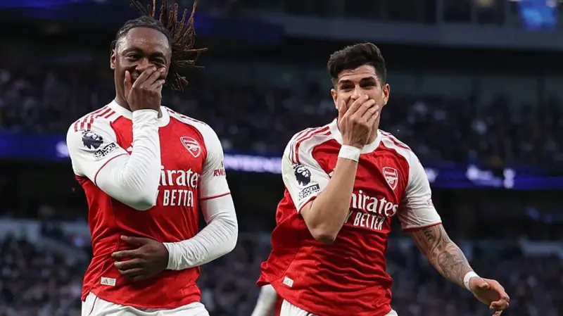 Eberechi Eze celebrates with Piero Hincapie after putting Arsenal ahead at Spurs