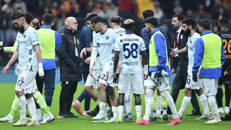 Adana Demirspor players withdraw from the field in the Turkish Super Lig match at Galatasaray