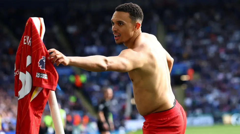 Liverpool's Trent Alexander-Arnold planted his shirt on the corner flag after scoring his winner at Leicester