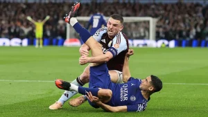 Villa's John McGinn and PSG's Achraf Hakimi, who both scored, tumble together during a second-half incident