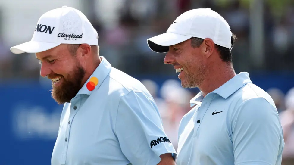 McIlroy (right) drained a 30-foot putt for eagle to finish the third round