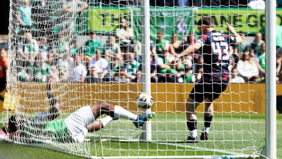 Rocky Bushiri clears Nicolas Raskin's shot away - but did it cross the line?