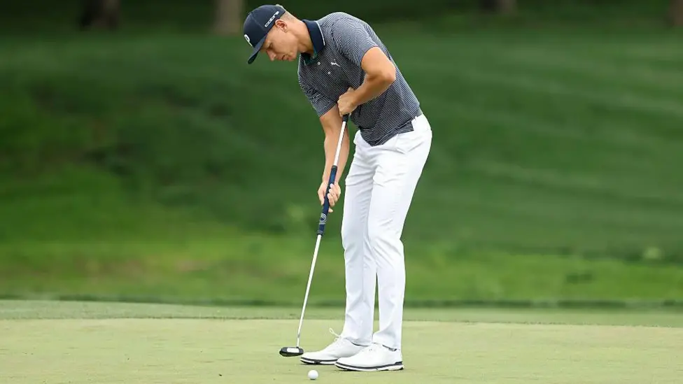 There is no daylight between Matti Schmid's left thumb and his shirt, leading to discussions about whether he might be 'anchoring' his putter