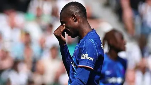 Chelsea's Nicolas Jackson walks off after being shown a red card in the defeat at Newcastle United