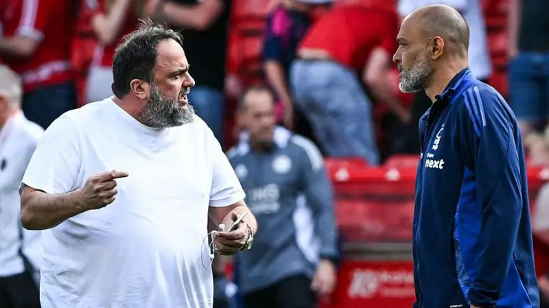 Nottingham Forest owner Evangelos Marinakis (left) made his way on to the pitch at full-time