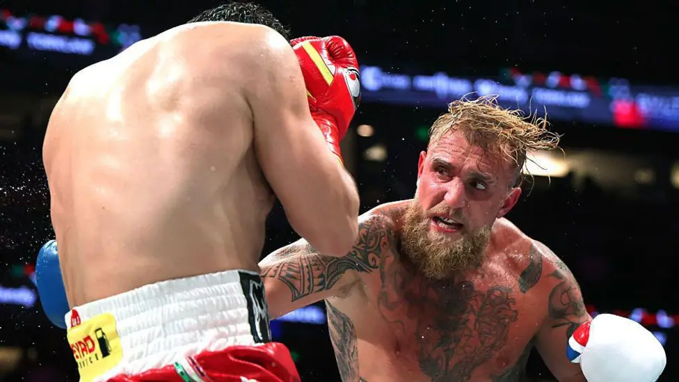 Jake Paul (right) won his 12th pro boxing fight and said he would target a world title shot