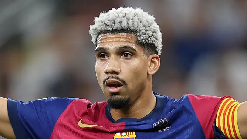 Ronald Araujo has returned early to training under Hansi Flick, but Barcelona’s financial concerns may still force a decision on his future.