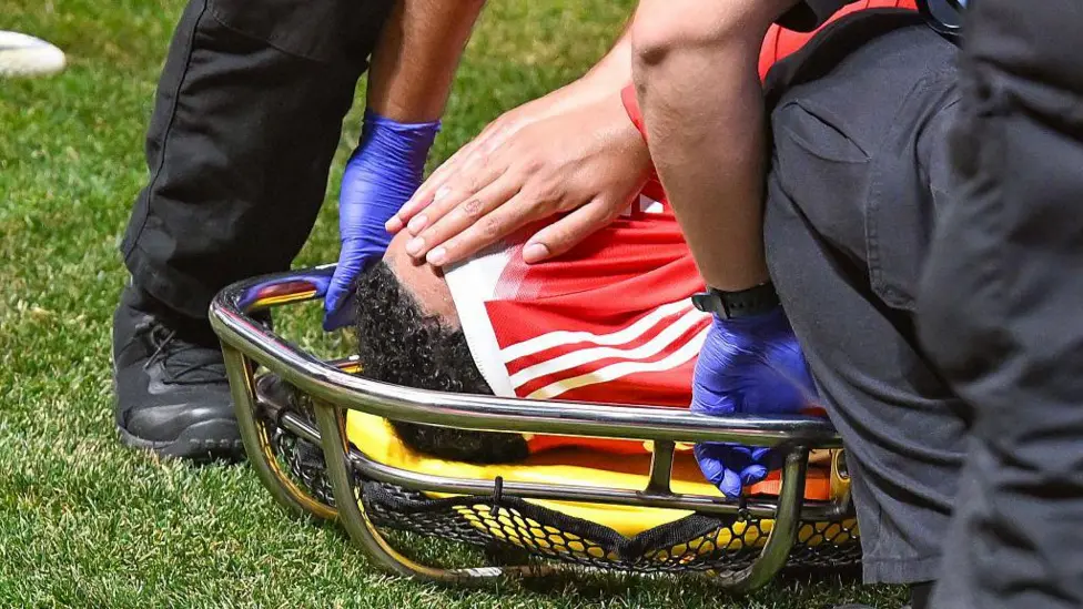 Jamal Musiala covered his face with his shirt when he was taken off on a stretcher following the contact with Gianluigi Donnarumma