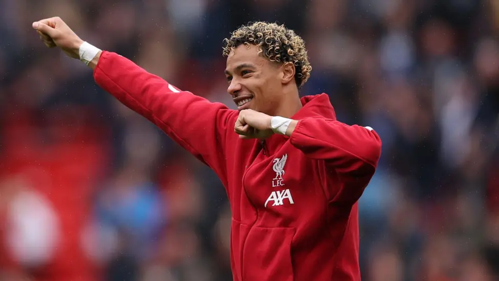 Hugo Ekitike acknowledges the acclaim of Liverpool's fans after the Merseyside derby win against Everton at Anfield