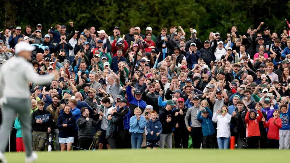 There were scenes of unbridled joy in the crowd as McIlroy's eagle putt dropped - with the celebrations of two young lads dressed in red tops particularly noticeable