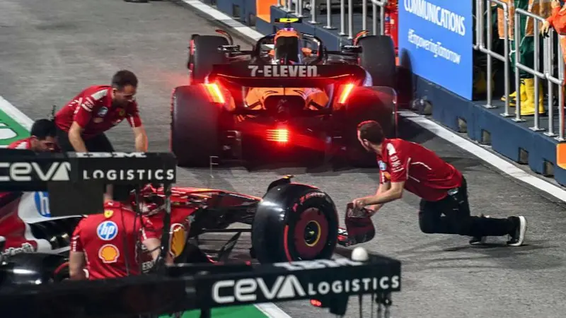 The aftermath of the collision between Ferrari's Charles Leclerc and McLaren's Lando Norris in the pit lane