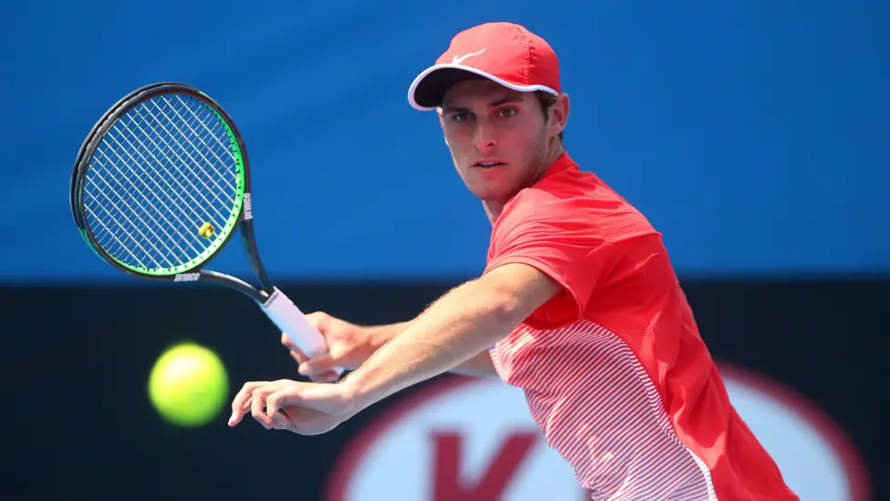 Anderson, pictured here during his Australian Open boys' title run, says an annual wooden racquet Christmas social with his mates was the only time he played tennis during his seven-year hiatus