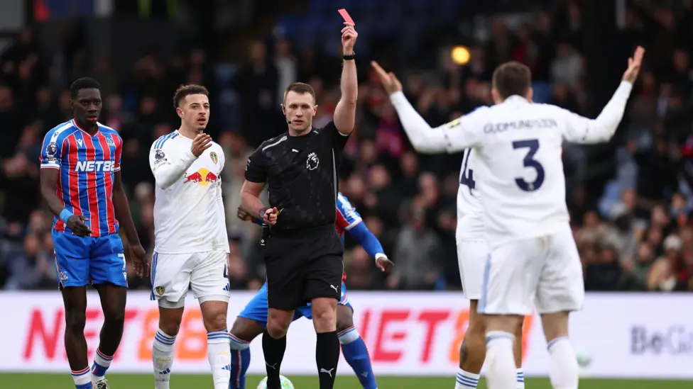 Referee Thomas Bramall sent off Leeds defender Gabriel Gudmundsson just before half-time