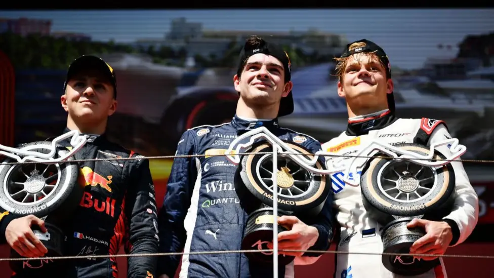 After his win in the 2024 F2 Monaco feature race, Zak O'Sullivan (centre) shared the podium with current Red Bull driver Isack Hadjar and Alpine reserve driver Paul Aron