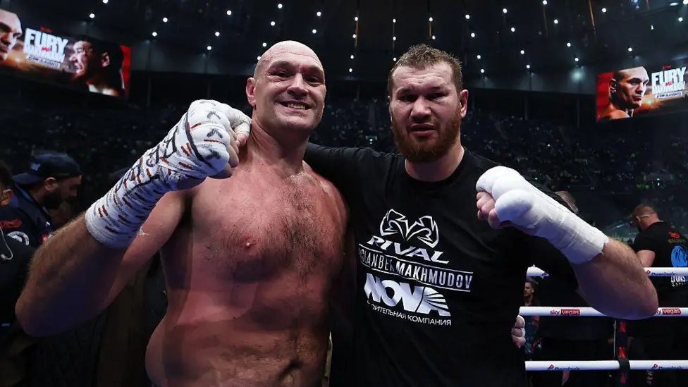 Tyson Fury (left) claimed a unanimous points win over Arslanbek Makhmudov